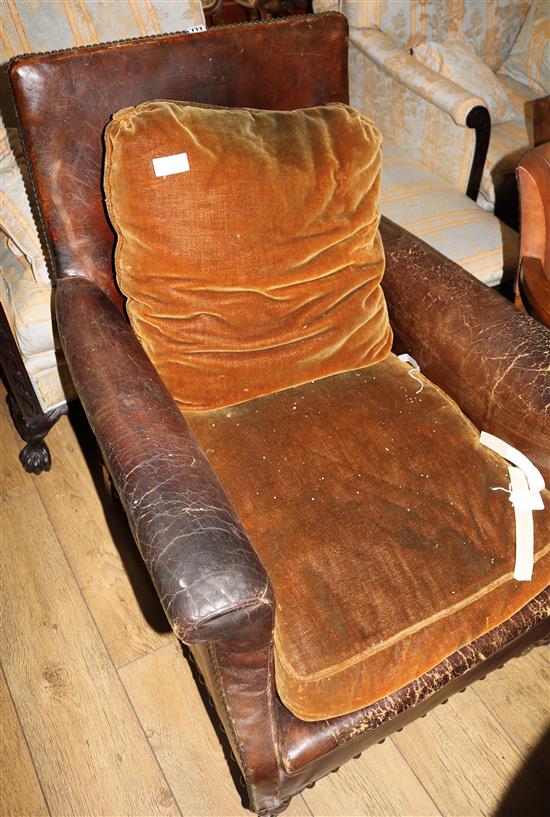 A 1930s French brown leather armchair